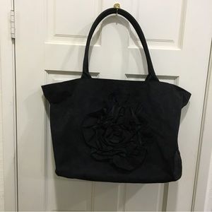 Murvoi large black suede purse with a large suede ruffled rose